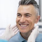 dentist checking dental implants